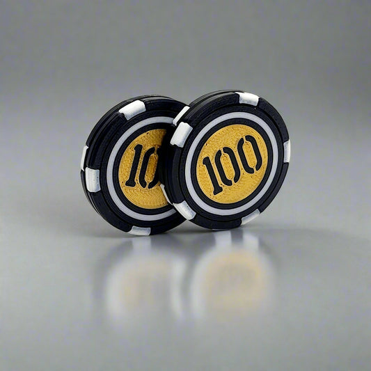 Poker chip coin separated to reveal internal magnets