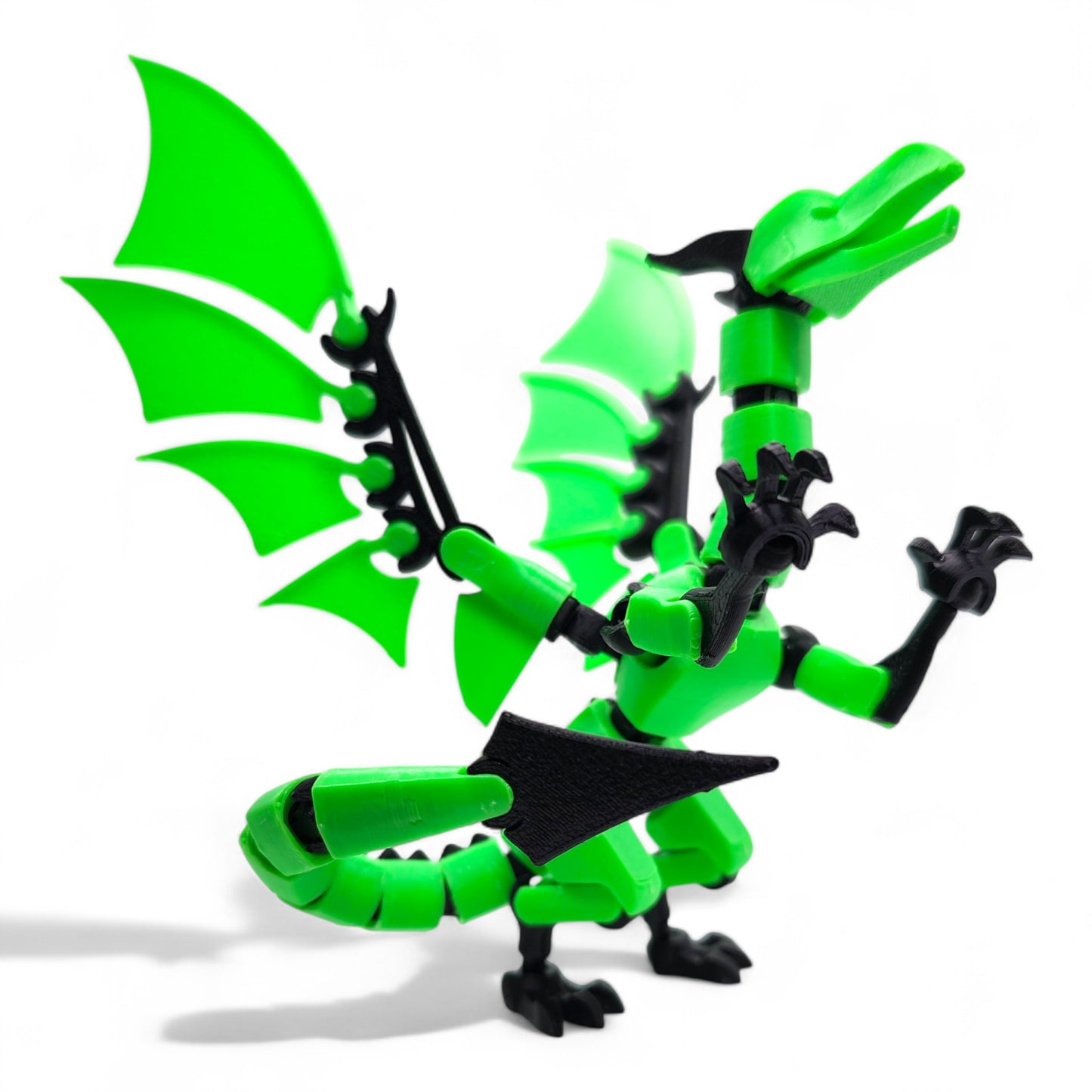 articulated dragon action figure posed with wings spread