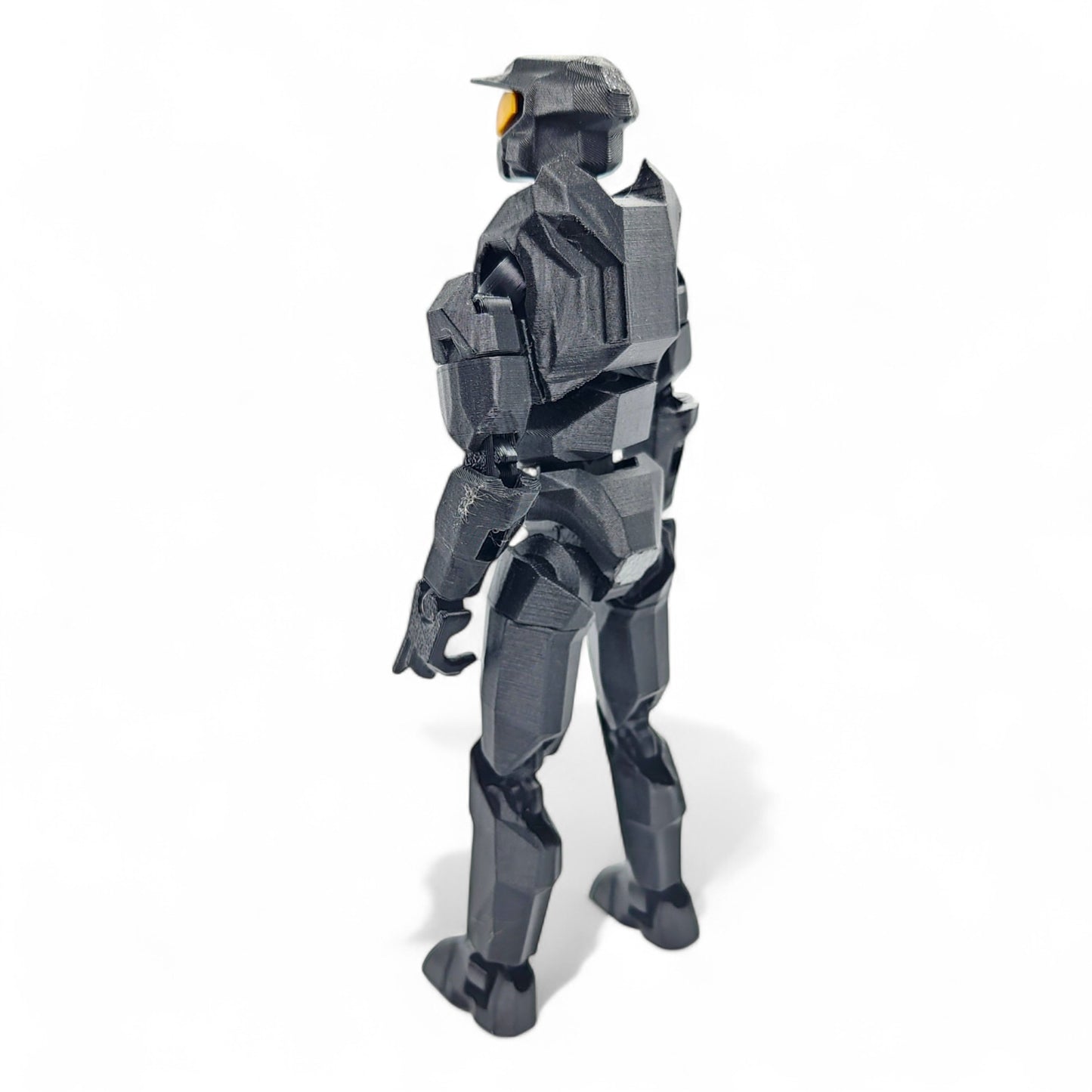 Back view showing sculpted details and helmet shape.