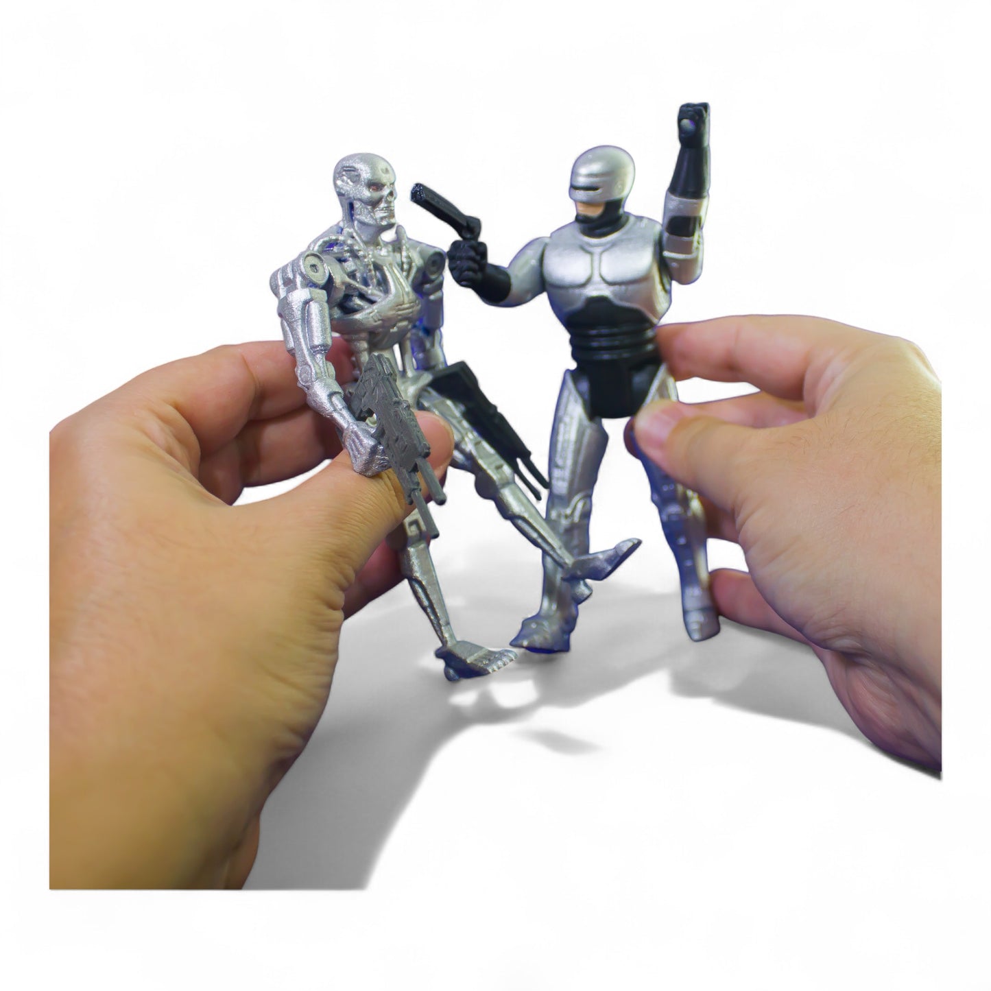 RoboCop figure in hand, showing 14 cm scale