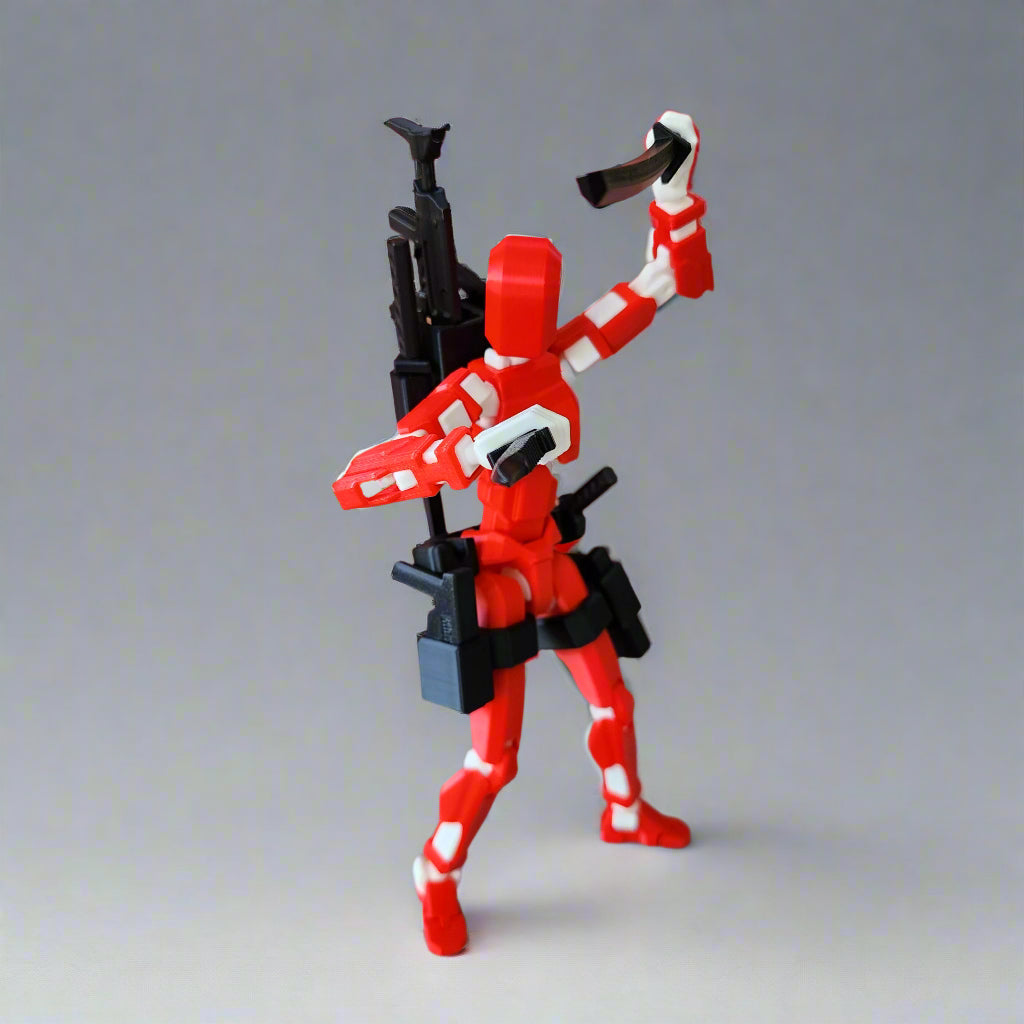 Oversized Dummy 13 action figure in full tactical armour with chest plate, thigh holsters, and weapon pack, posed standing front-on.