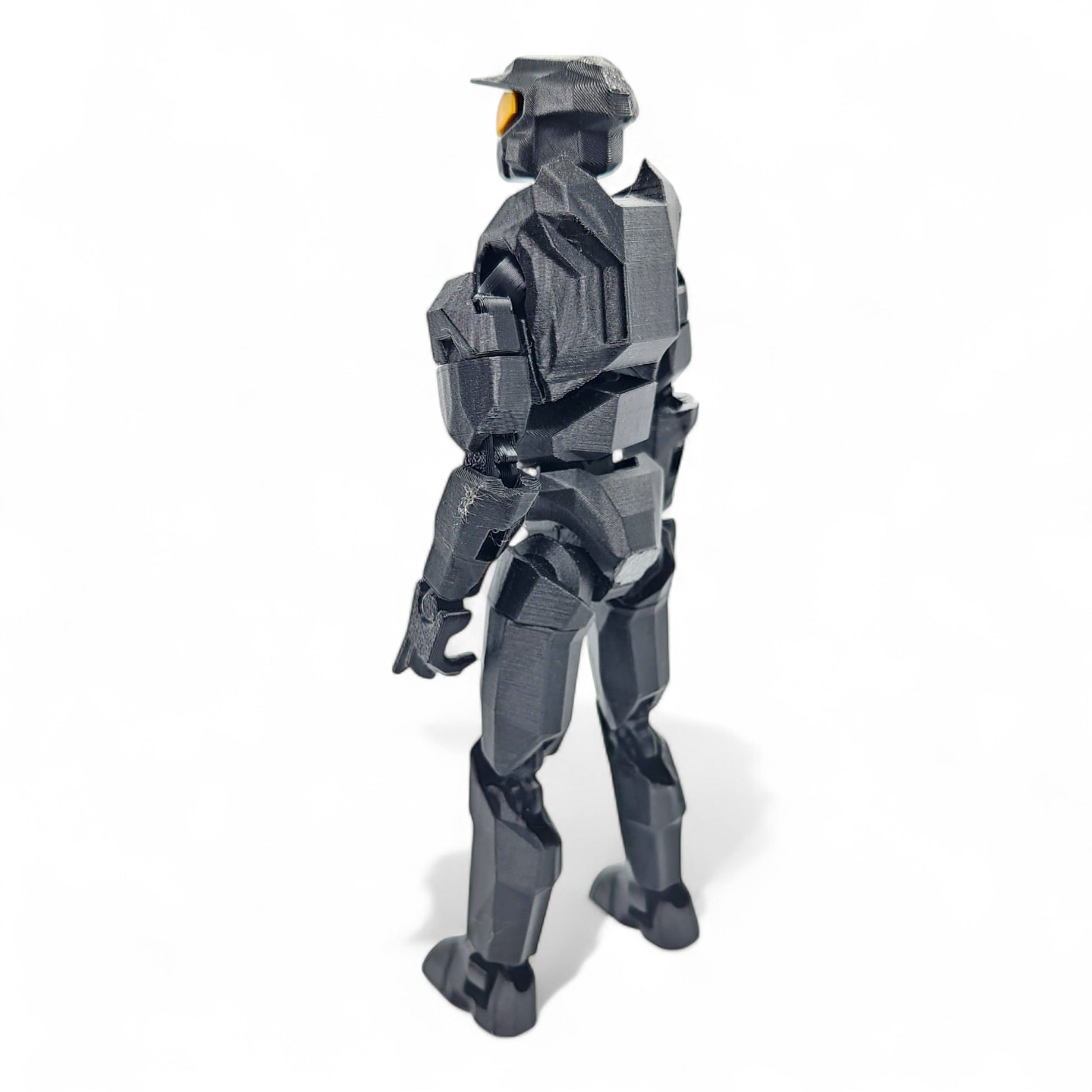 Back view showing sculpted details and helmet shape.