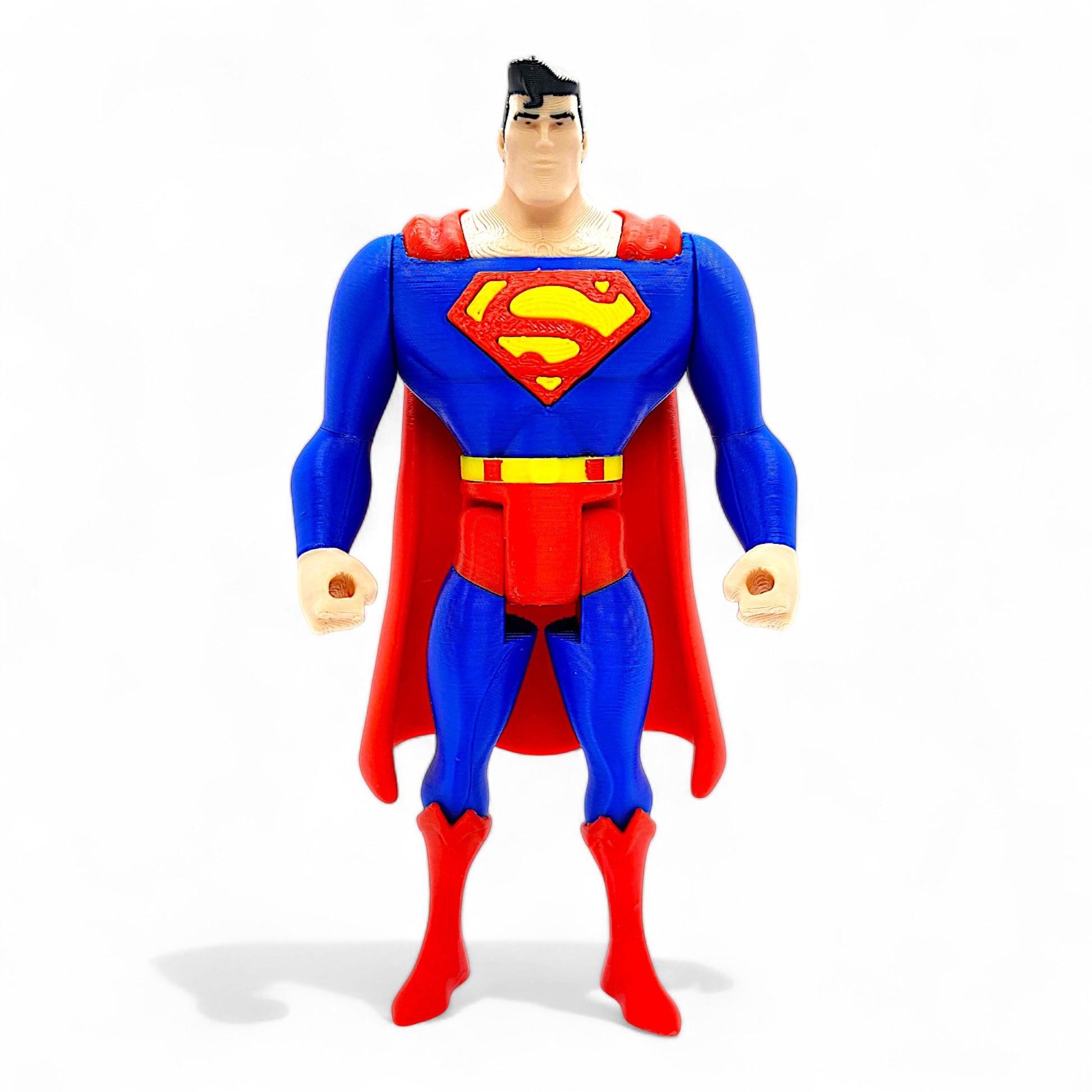 Animated-style Superman retro action figure in classic blue and red, front view